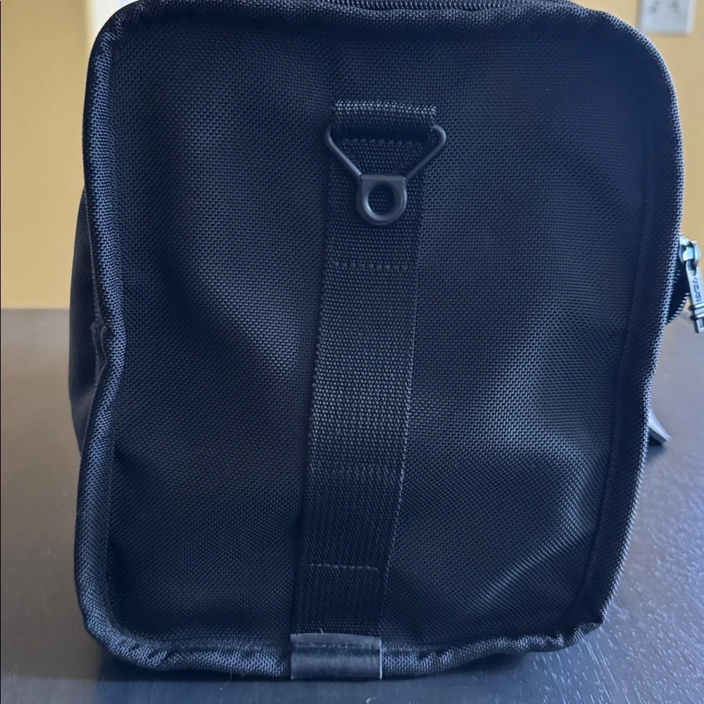 Tumi Black Men's Duffel with Red Logo Luggage Tag